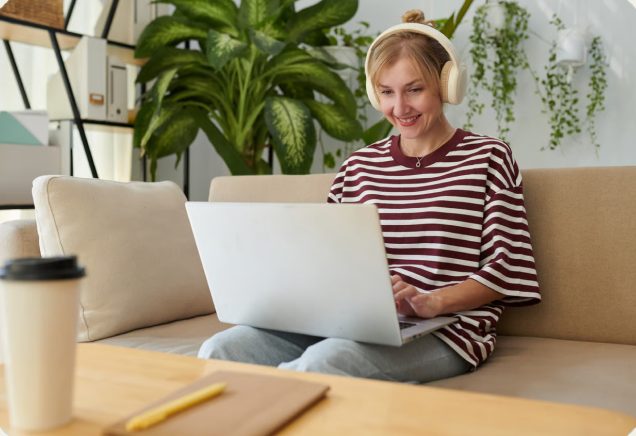 Woman completing an online consultation on her laptop at home